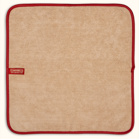 Set of four beige placemats with red edges and a visible brand logo on a white background