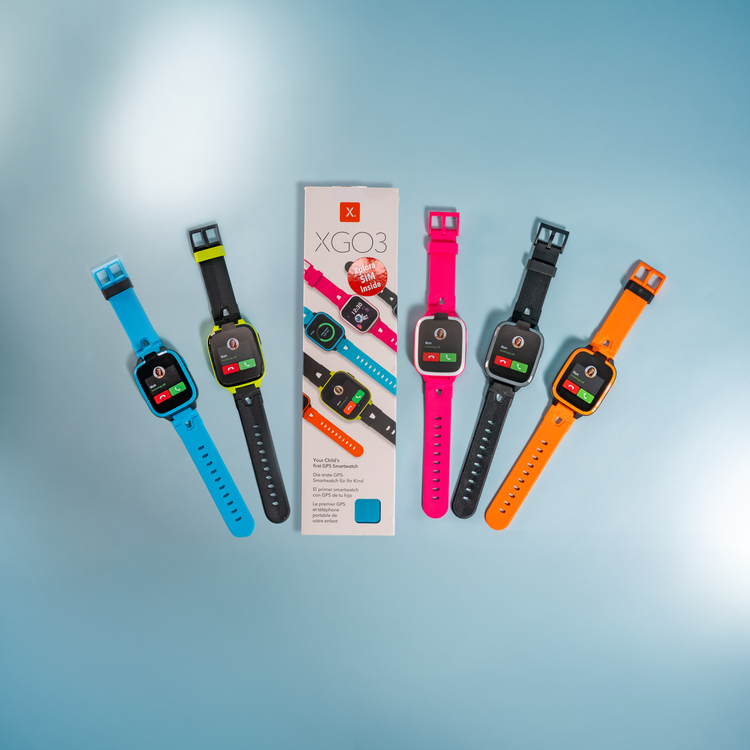 Four colorful smartwatches with a packaging box labeled 'XGO3' on a light blue background.