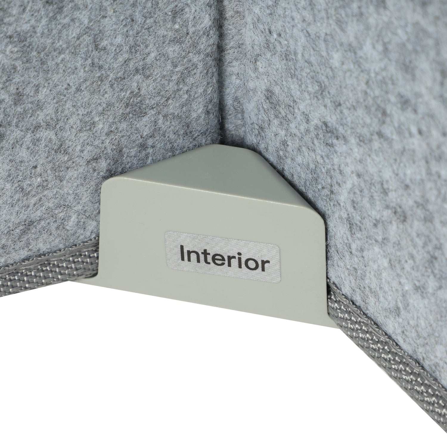 Corner of a textured gray wall with a light gray corner block labeled 'Interior'.