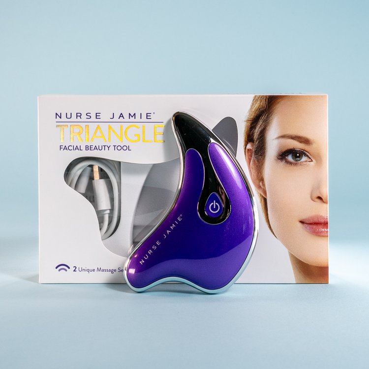 Nurse Jamie Triangle facial beauty tool with packaging on a light blue background