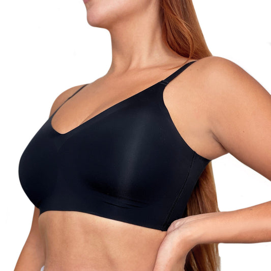 A model wears a black bra and pants against a white background. The front of the bra is displayed. 