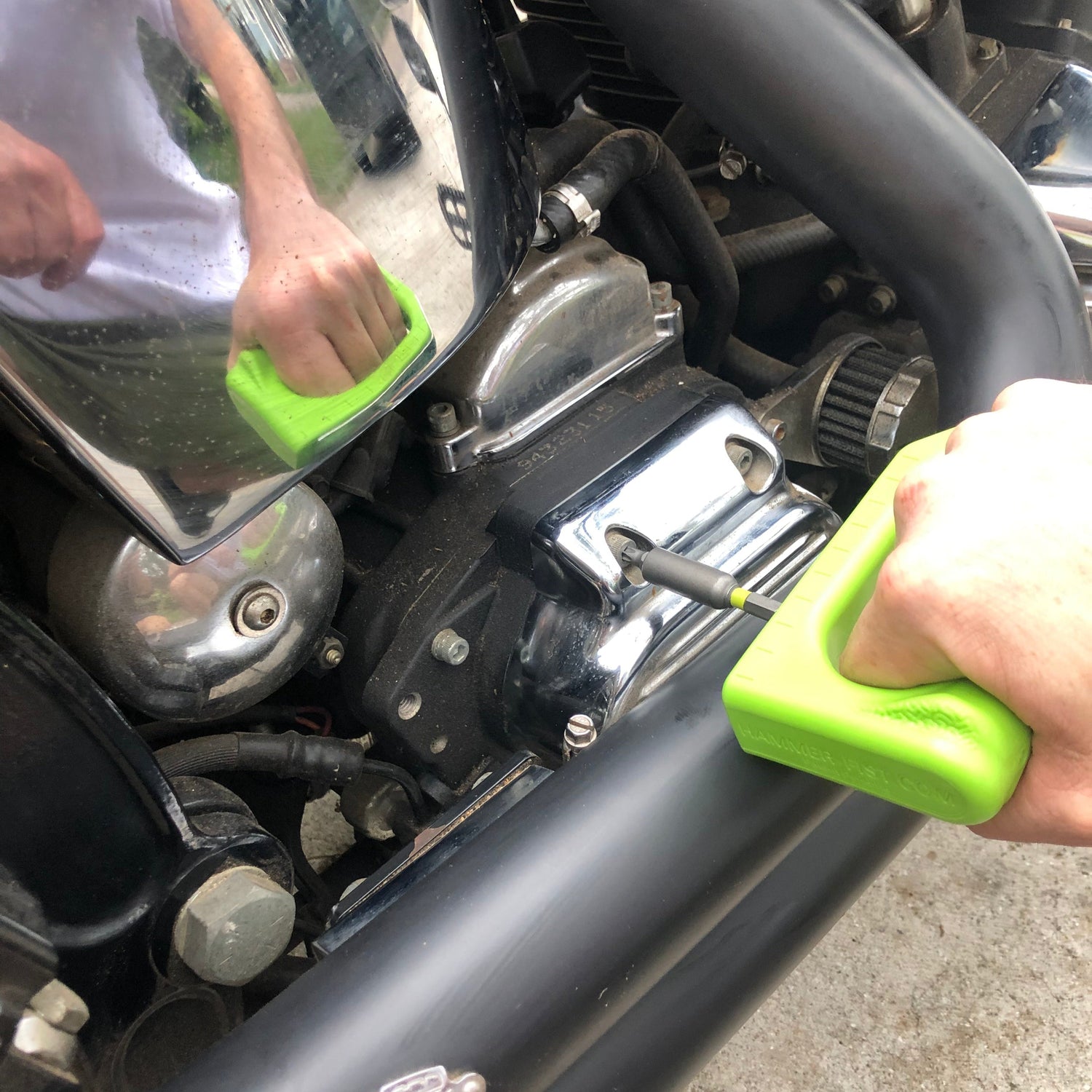 hammer fist hex key feature being used to fix motorcycle 
