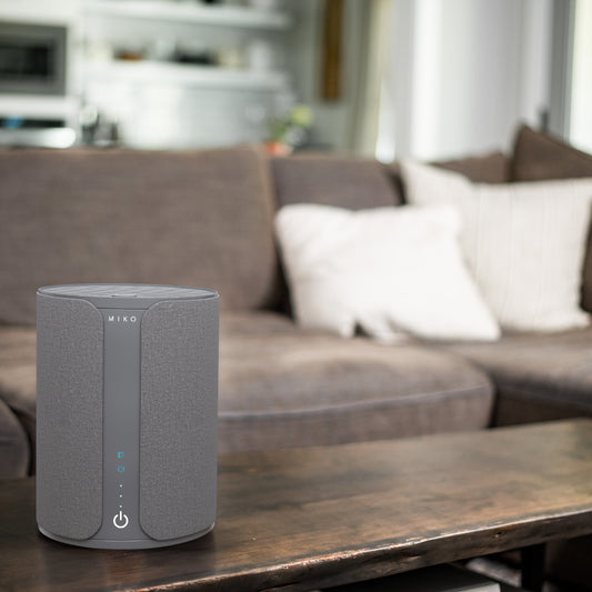 Miko smart device with smartphone displaying app interface on a white background