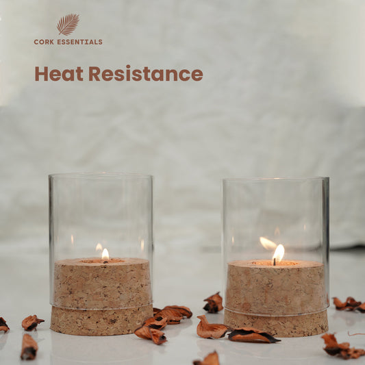 Two candle holders with candles inside on a white background