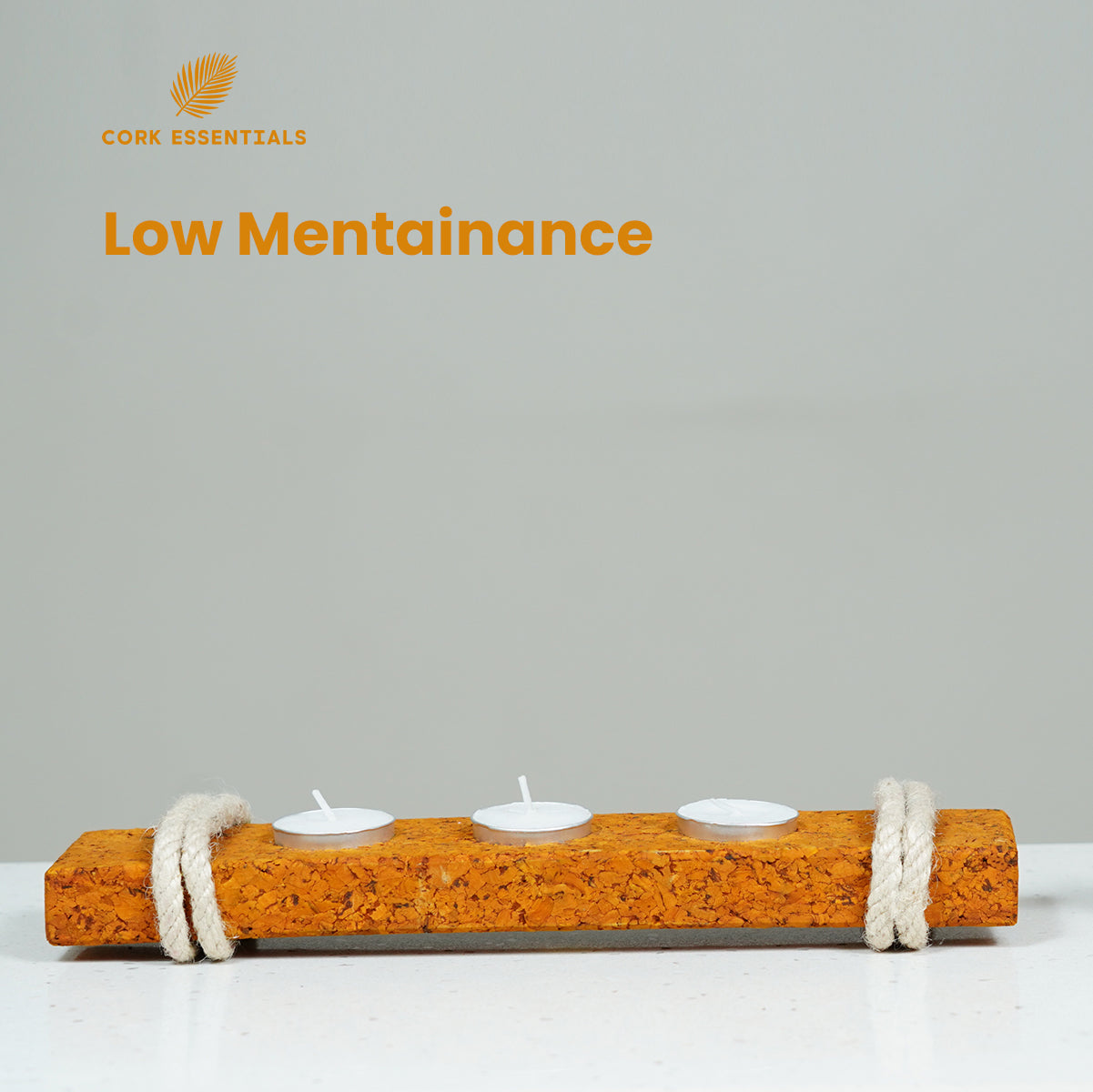 Cork candle holder with three candles on a gray background, featuring 'Cork Essentials' branding.