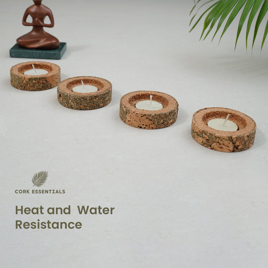 Set of four stone-look candles on a white background