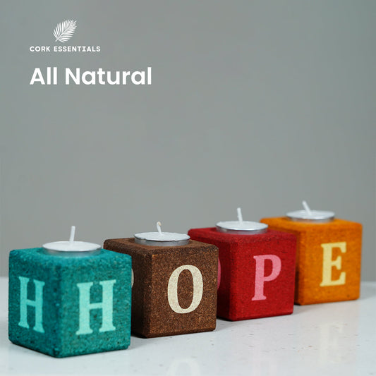 Colorful blocks spelling 'HOPE' with small candles on a white background