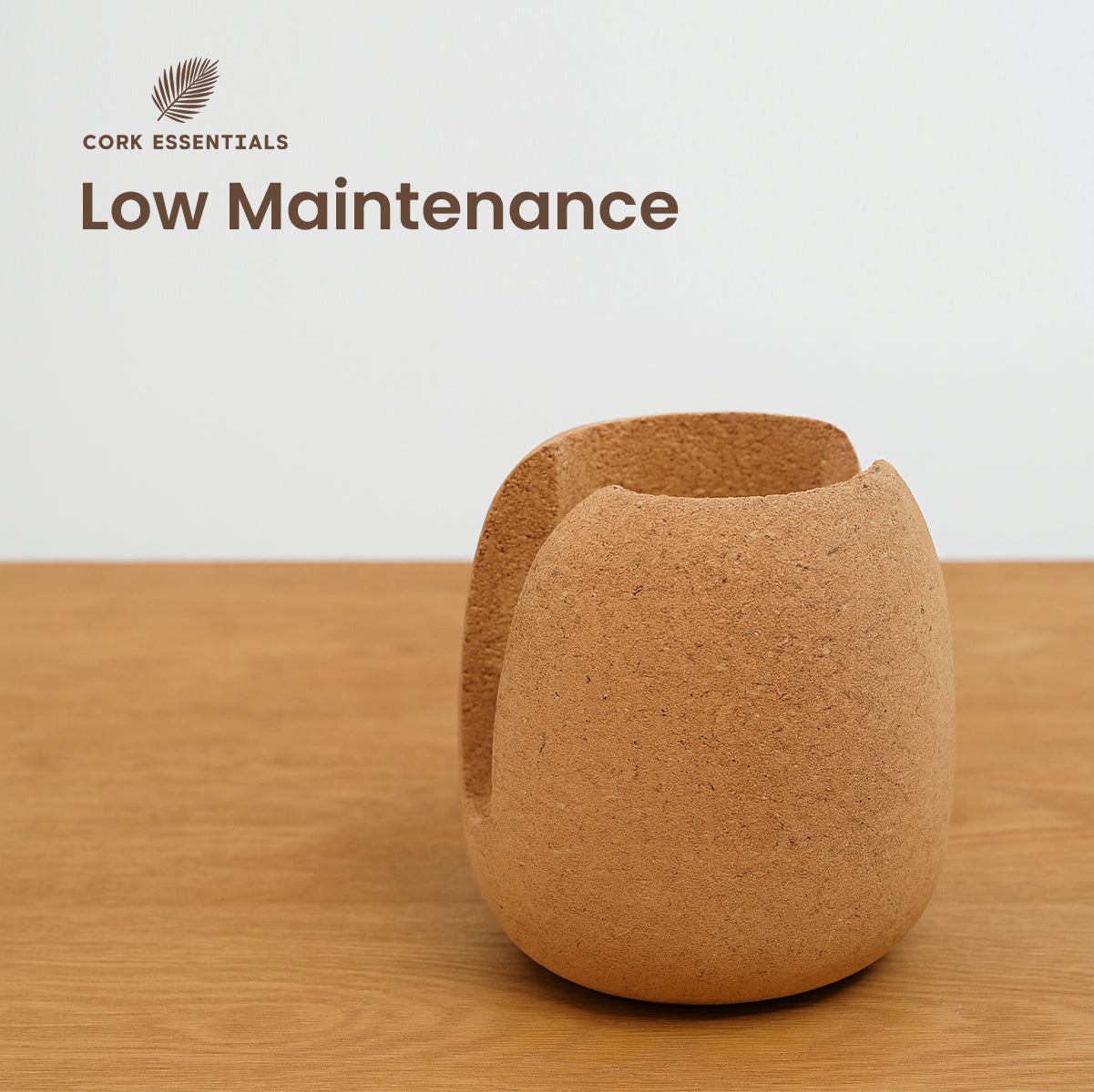 Cork cup on a wooden surface with 'Cork Essentials' branding and 'Low Maintenance' text.