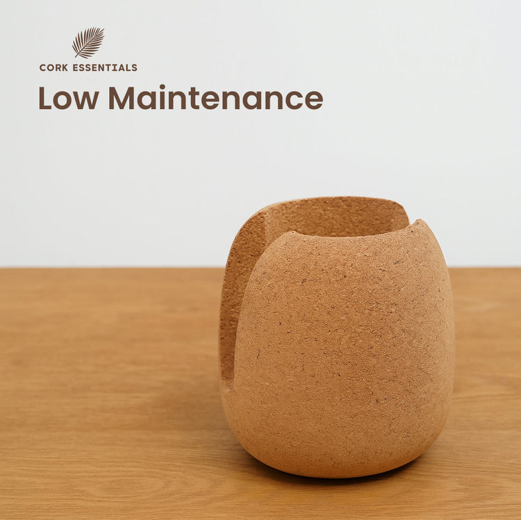 Cork cup on a wooden surface with 'Cork Essentials' branding and 'Low Maintenance' text.