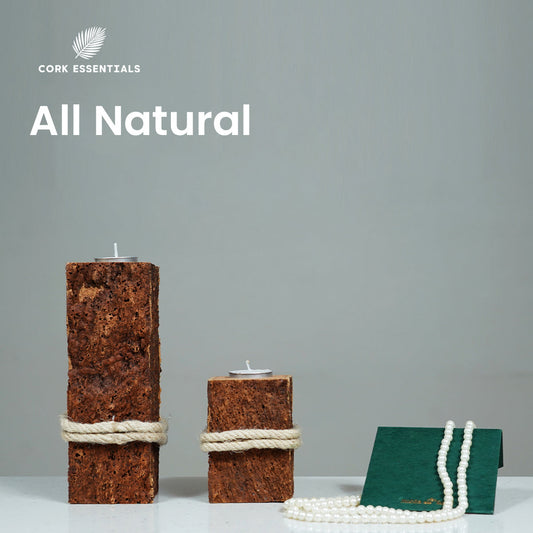 Three square-shaped candle holders made of cork with rope around them on a white background.