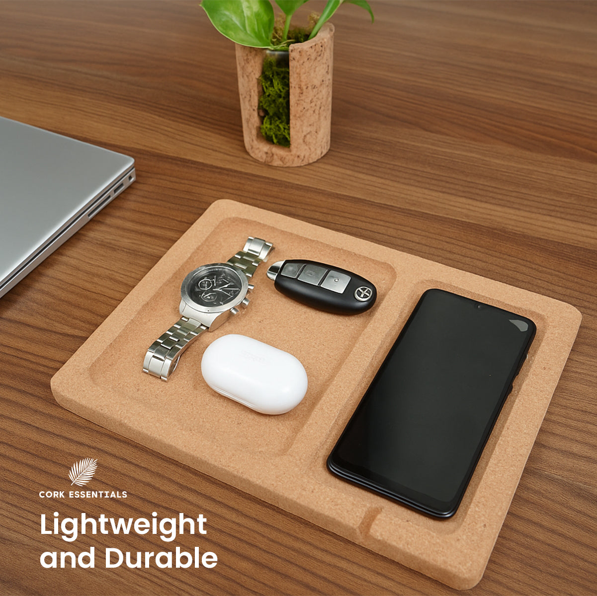 Cork trivet with phone, keys, and watch on a wooden surface with 'Cork Essentials' branding.