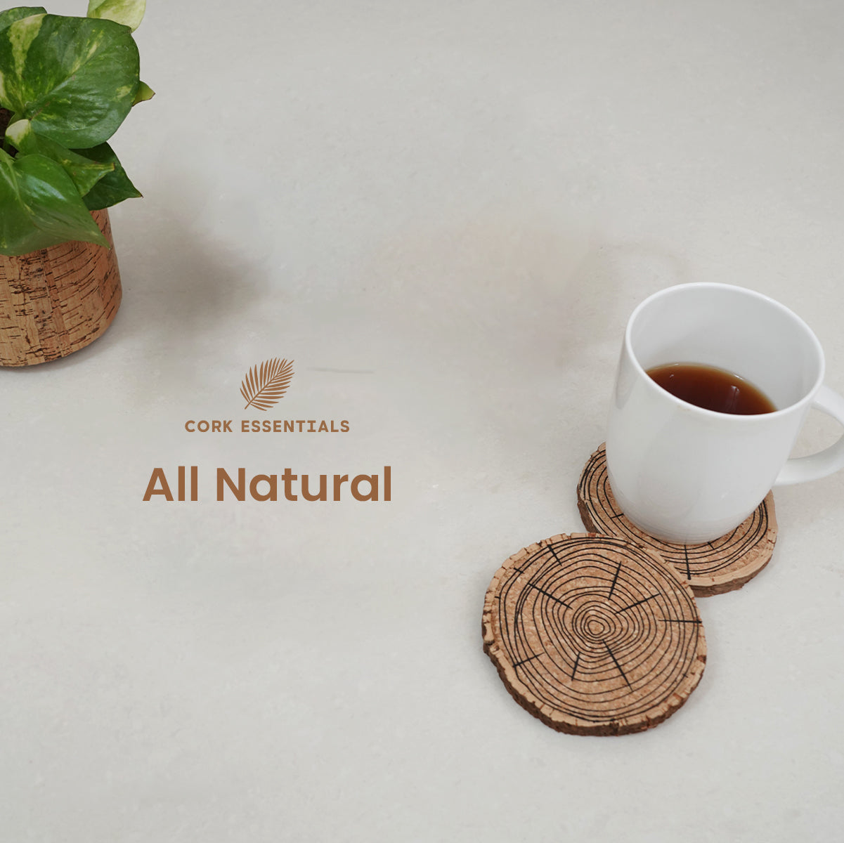 Cork coasters with a cup of coffee on a light surface, featuring the 'Cork Essentials' brand.