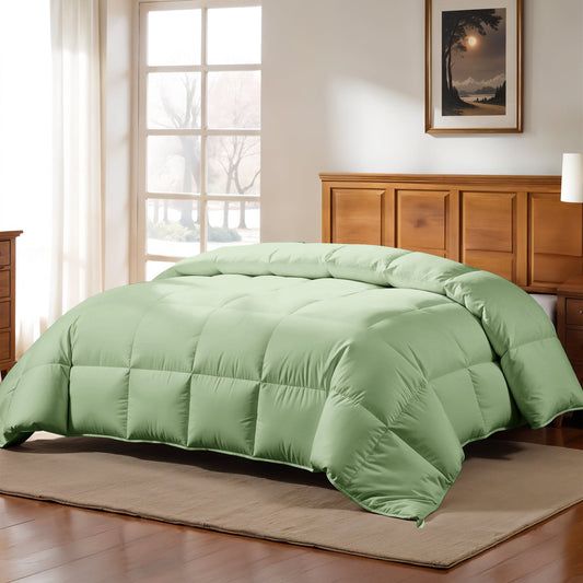 Green comforter on a bed in a modern bedroom setting