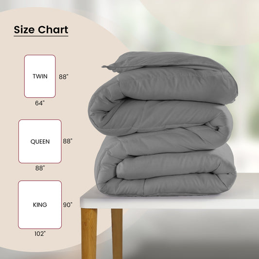 Gray comforter on a bed in a modern bedroom setting