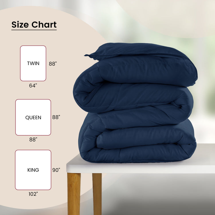 Stack of blue comforters on a table with size chart labels.