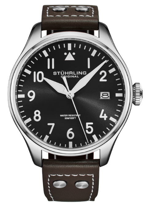 Stuhrling watch with black face and brown leather strap on a white background