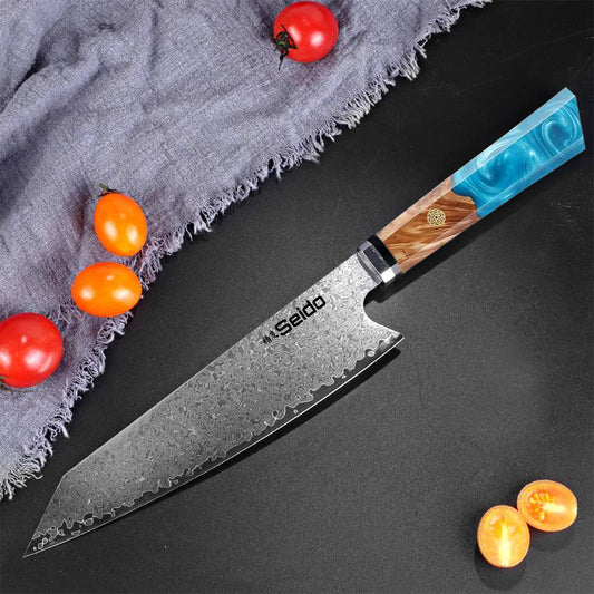 Sakao Damascus kitchen knife with wooden handle and branded packaging on a white background
