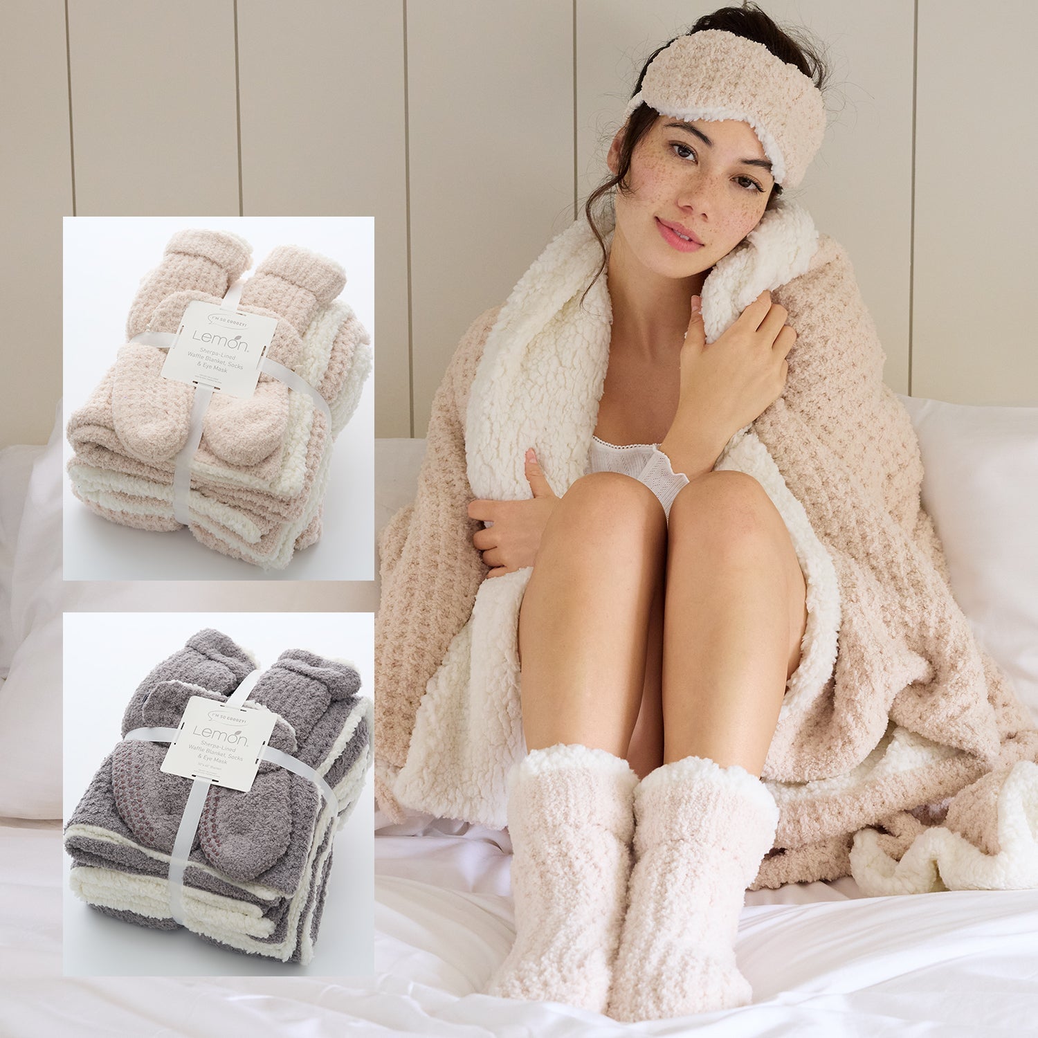 Woman wrapped in a beige blanket with matching headband and footies, surrounded by folded blankets.