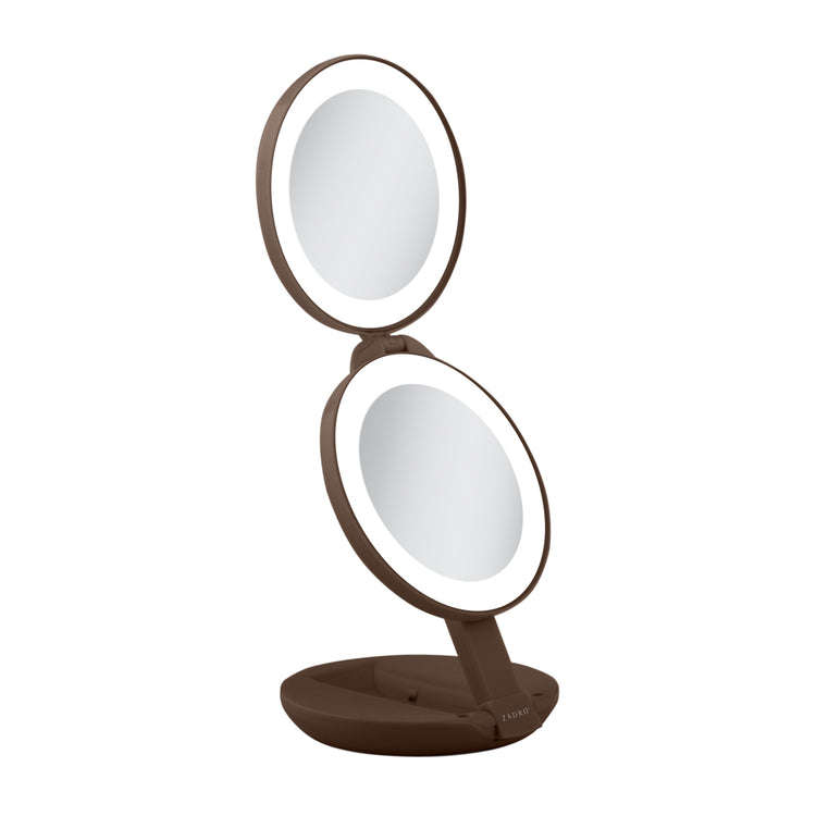 Brown double-sided vanity mirror on a white background