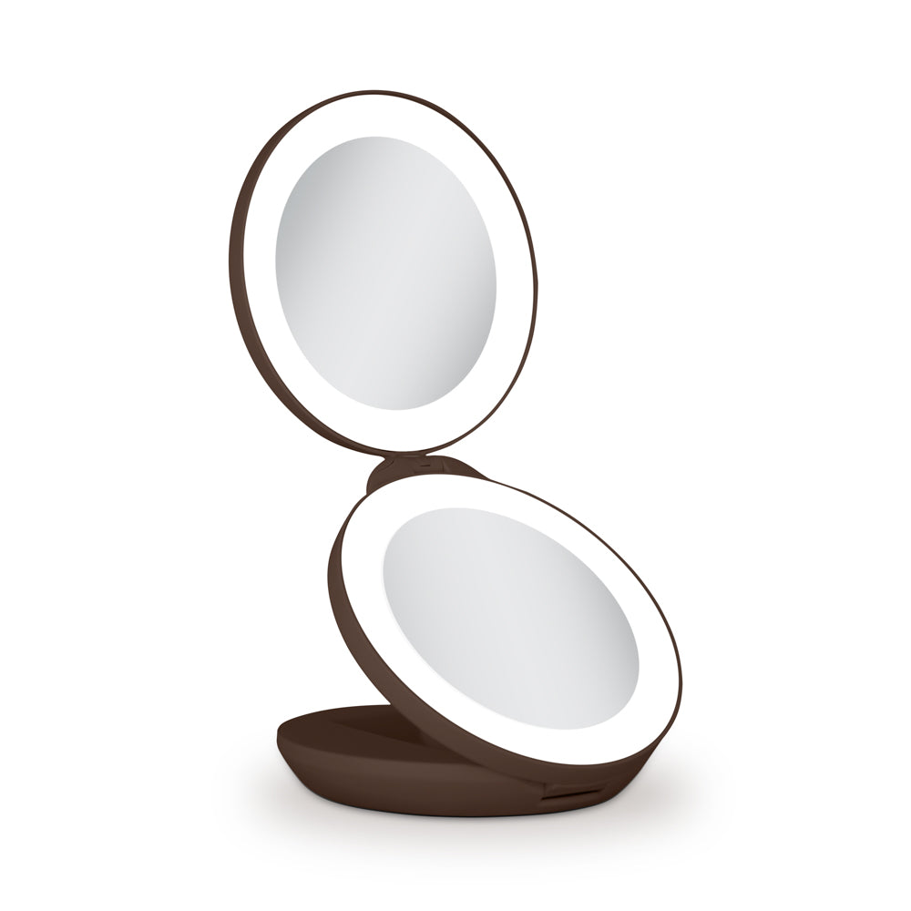 Compact mirror with a brown frame on a white background