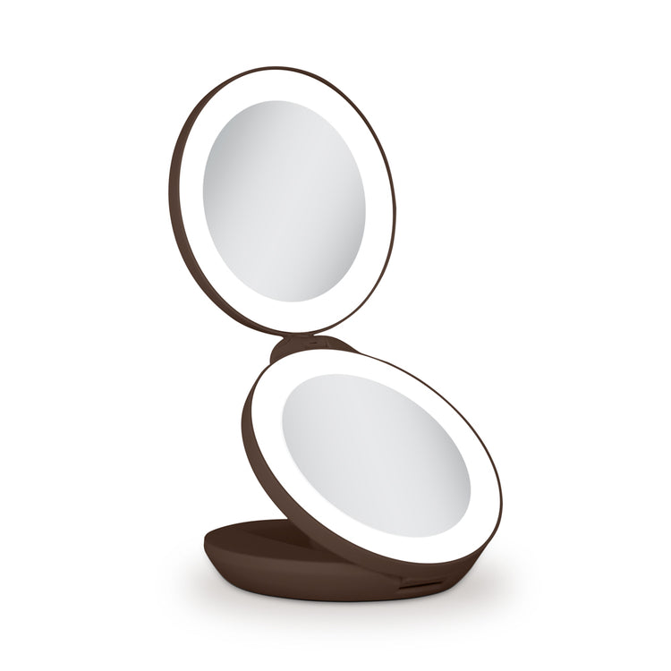 Compact mirror with a brown frame on a white background