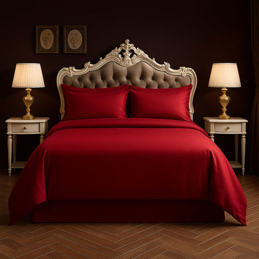 Dark-themed bedroom with black bedding, nightstands, and lamps.