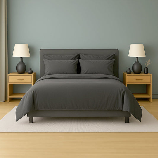 Neatly made bed with beige bedding in a bedroom setting.
