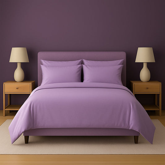 Neatly made bed with white bedding and pillows in a room with wooden nightstands and lamps.