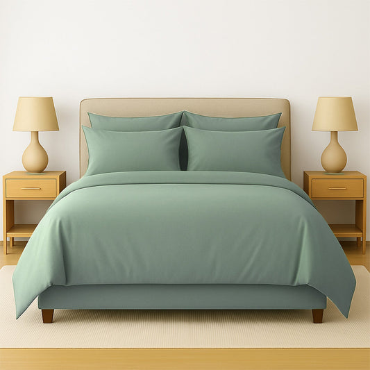 Neatly made bed with white bedding and pillows in a room with wooden nightstands and lamps.
