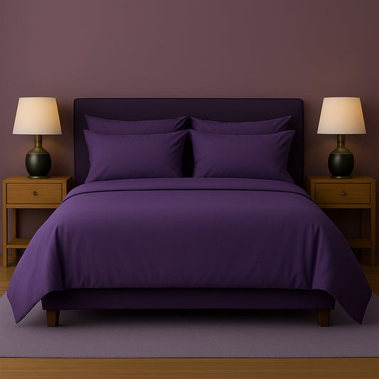 Dark-themed bedroom with black bedding, nightstands, and lamps.