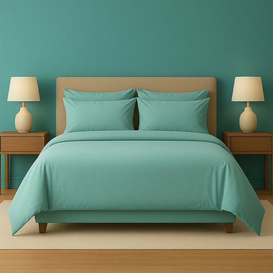 Purple bedding set on a bed with matching pillows in a room with purple walls and wooden nightstands.