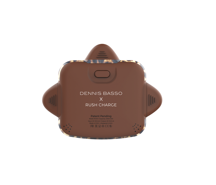 Brown electronic device with 'Dennis Basso x Rush Charge' branding on a white background