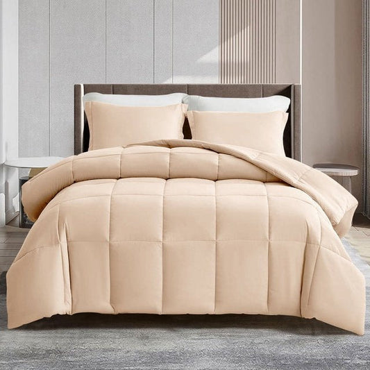 Beige comforter on a bed in a modern bedroom setting