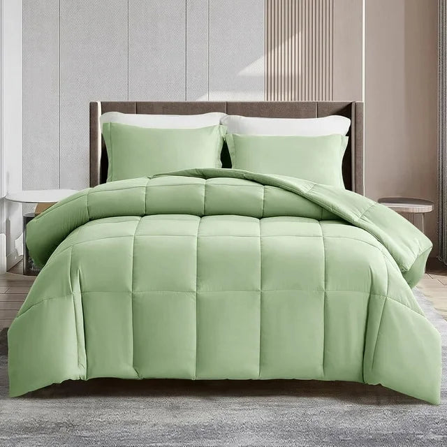 Green comforter set on a bed in a bedroom setting