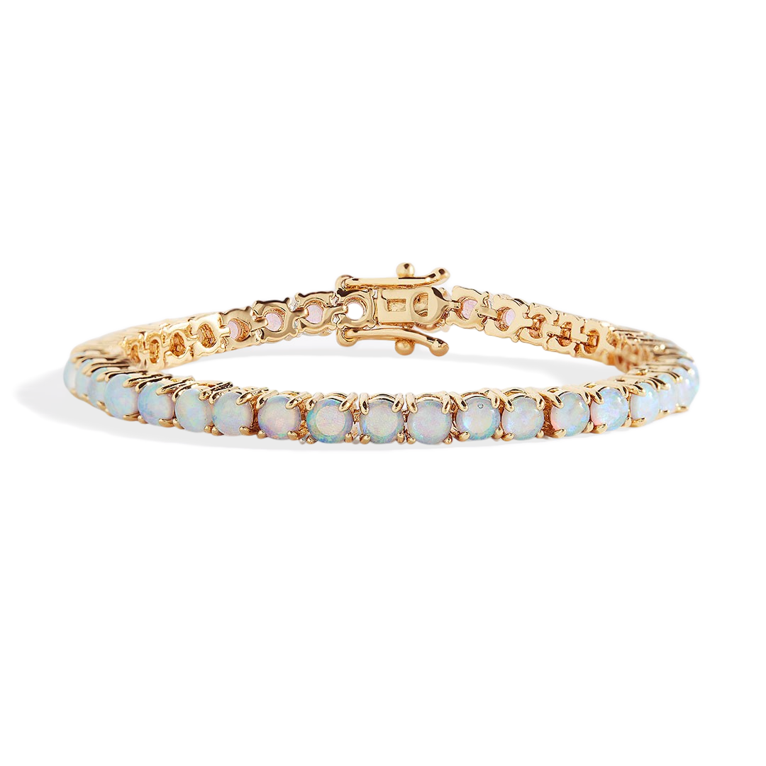 Gold bracelet with opal stones on a white background