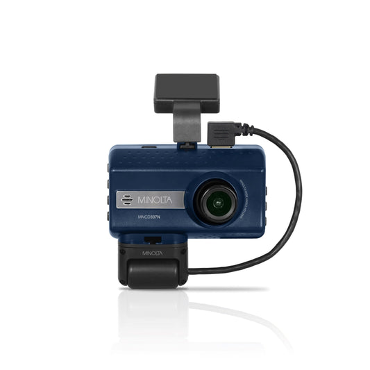 A black Minolta dash camera with a 3 inch screen, featuring an exterior camera lens on the front and a secondary interior camera attached on a swivel mount.