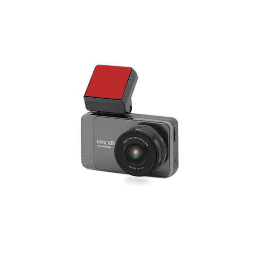 A Minolta brand dash cam in dark gray with a prominent red square-shaped light or filter mounted on top, shown against a plain white background.