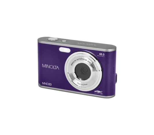 Purple Minolta digital camera on a white background
