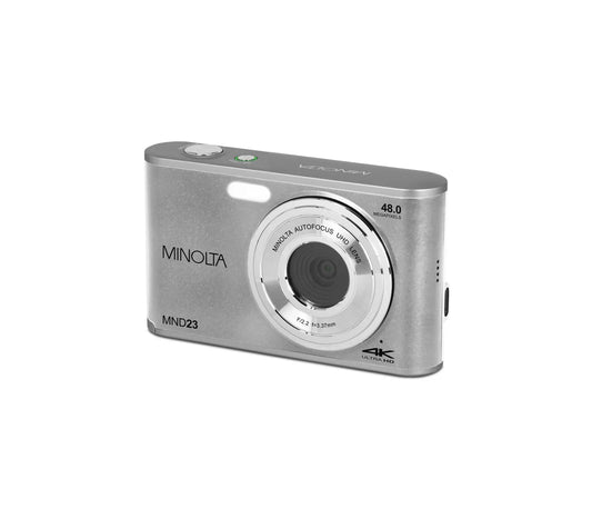 Silver Minolta digital camera on a white background