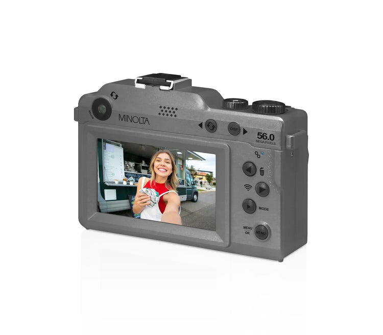 Minolta camera with a display screen showing a person holding money.