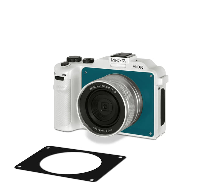 Minolta camera with lens cap and black filter on a white background