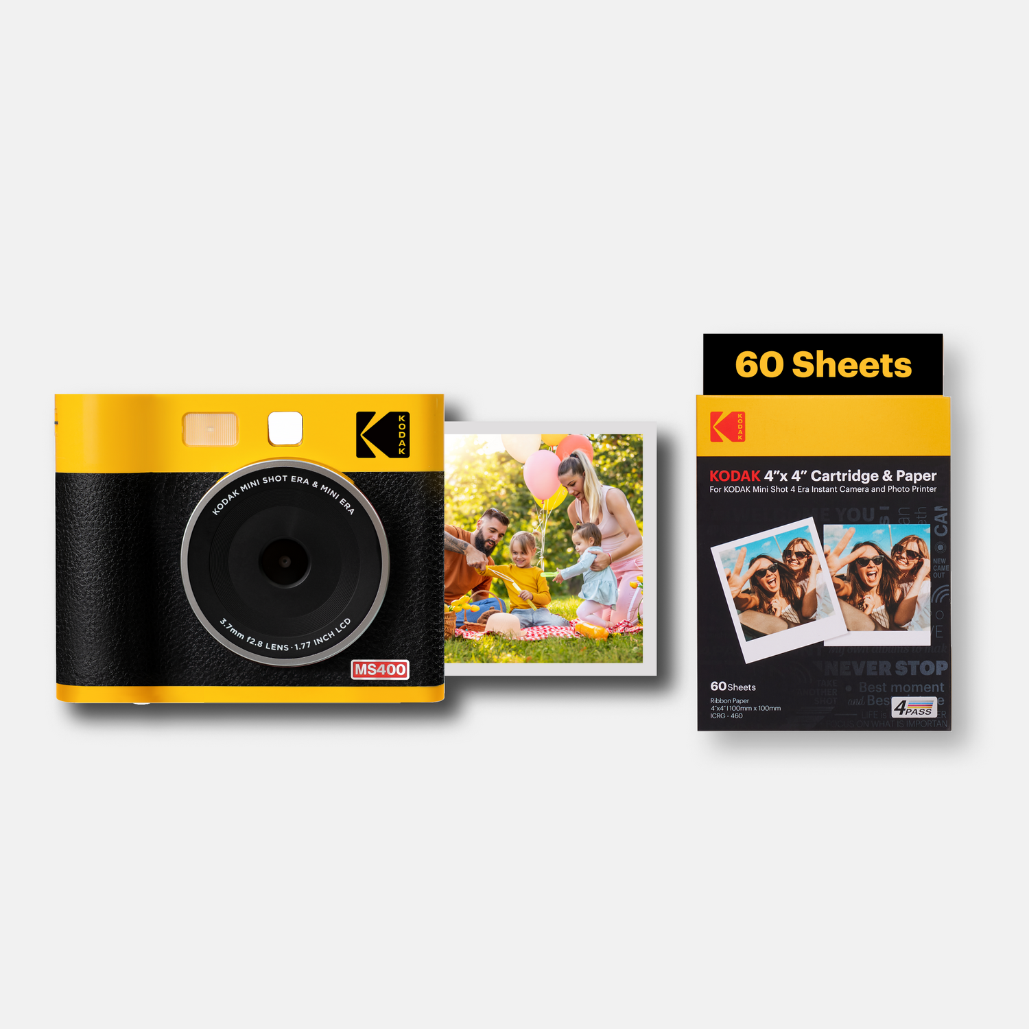 Kodak instant camera with a photo and a pack of Kodak photo paper on a white background