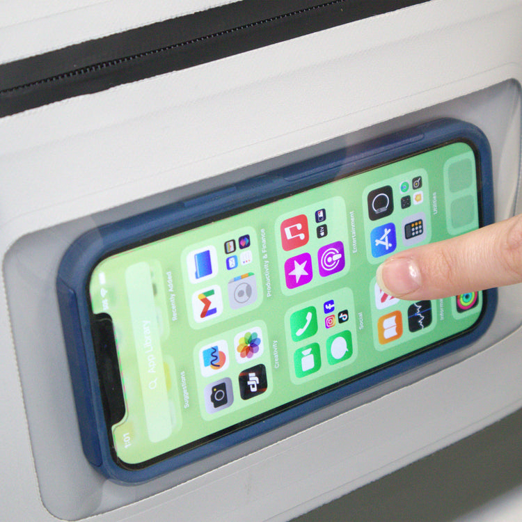 Phone with app icons on a screen held by a finger against a white background