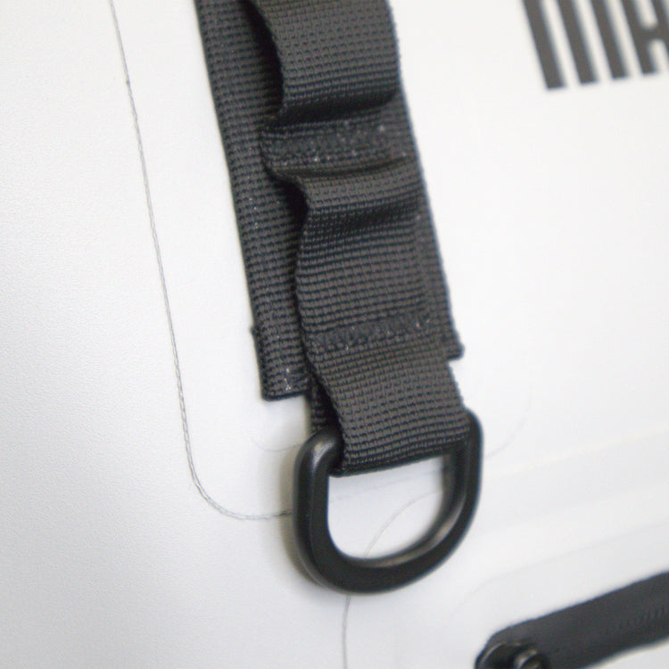 Close-up of a black strap with a carabiner on a white background