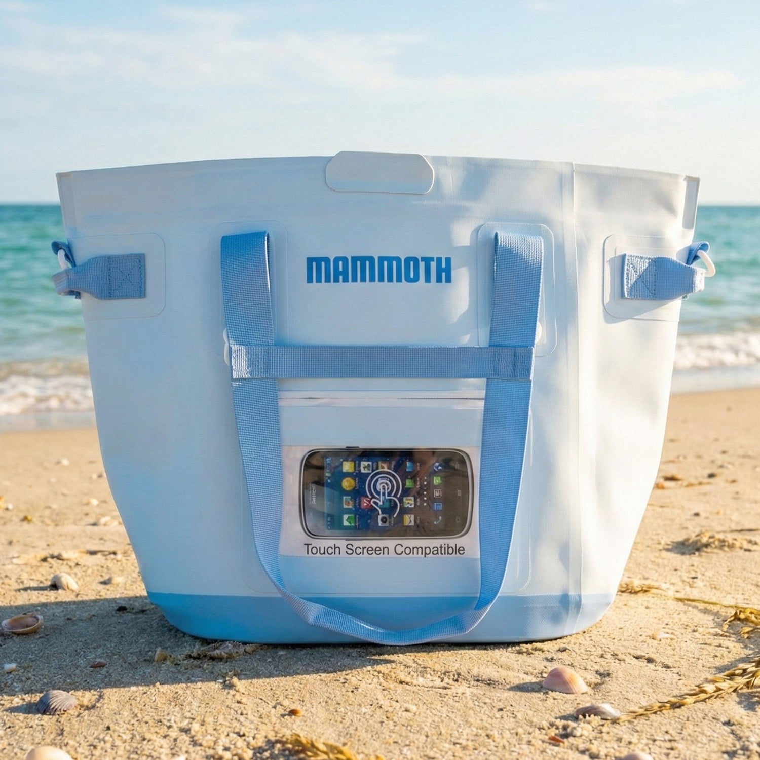 Mammoth cooler bag on a sandy beach with ocean view