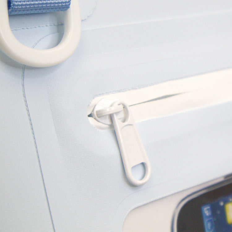 Close-up of a car seat with a white strap and blue buckle on a light gray background