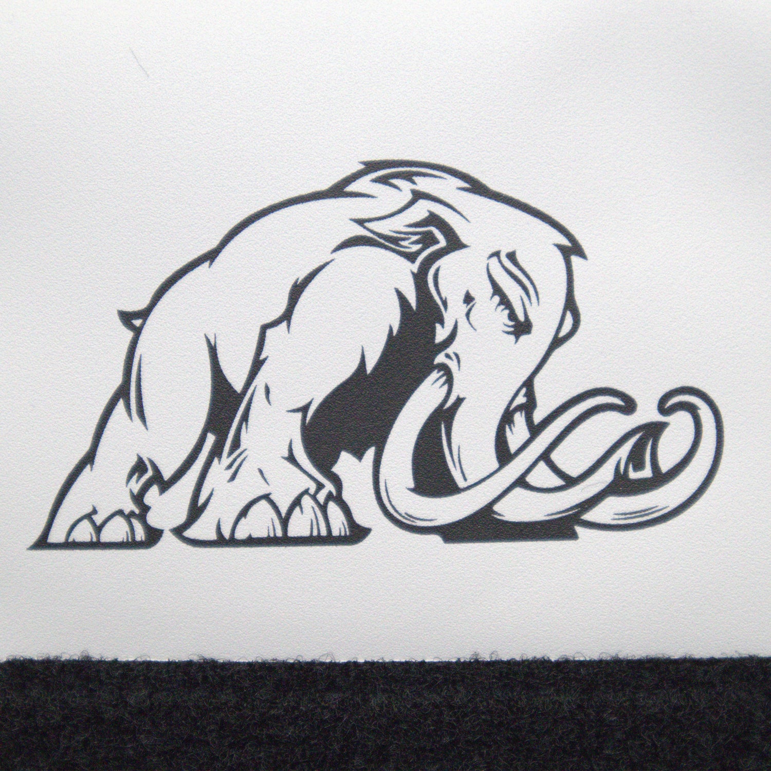 Black and white illustration of a mammoth on a white background