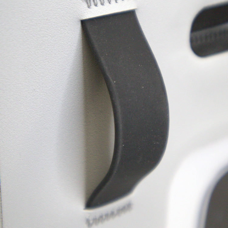 Close-up of a black plastic component on a white background