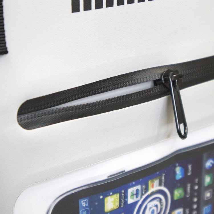 Close-up of a black zipper on a white surface with a smartphone displaying a screen.