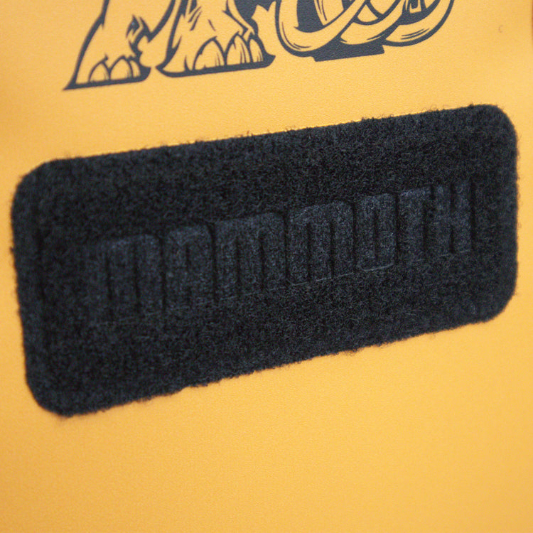 Black textured patch with 'GAMONTH' branding on a yellow background